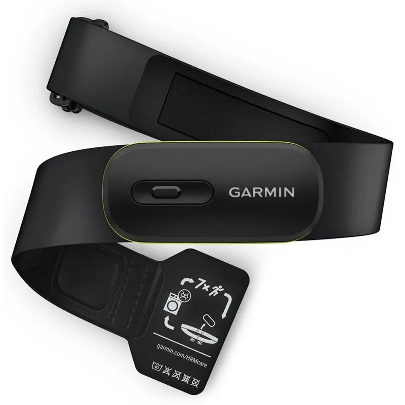 Garmin HRM 600 pulsband i svart med limegrön kant runt sensormodulen, liggande på sin elastiska rem